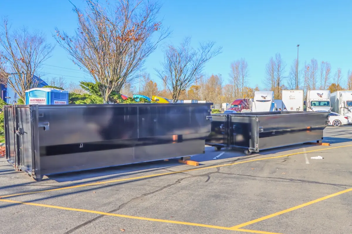 Professional dumpster rental service with roll-off container on residential driveway in SeaTac